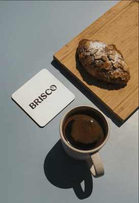 Coaster_with_the_cup_of_coffee_and_croissant_Brisco_logo-01-min_1.png copy